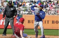  ?? AP ?? Dodgers second baseman Mookie Betts (right) and Angels outfielder Mike Trout (27) are among seven Major League Baseball MVPS on the 30-man rosters for the World Baseball Classic.