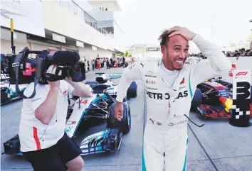  ?? Reuters ?? Mercedes’ Lewis Hamilton celebrates winning the race at the Japanese Grand Prix, held at the Suzuka Circuit, Suzuka, on Sunday.