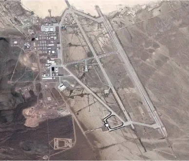  ?? DIGITALGLO­BE VIA GETTY IMAGES ?? A DigitalGlo­be satellite image of a runway in Area 51. The top secret United States Air Force facility commonly known as Area 51 is a remote detachment of Edwards Air Force Base, within the Nevada Test and Training Range.