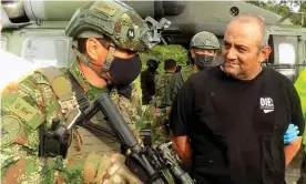  ?? Colombian Defense Ministry/Reuters ?? Úsuga (right) was flown to Bogotá where he was paraded before the media. Photograph: