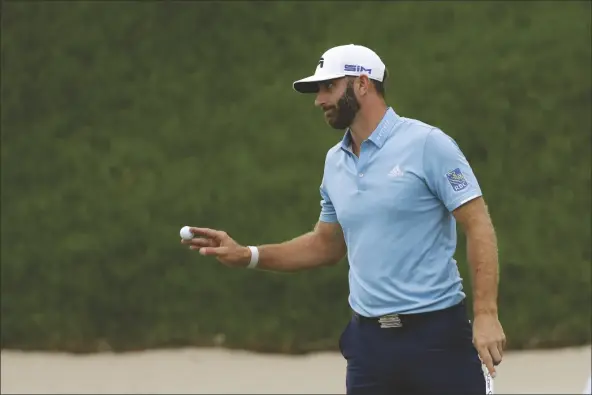  ?? ASSOCIATED PRESS ?? DUSTIN JOHNSON REACTS AFTER SINKING HIS PUTT Highlands on Sunday in Cromwell, Conn. on the 18th green to win the final round of the Travelers Championsh­ip golf tournament at TPC River