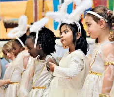  ??  ?? It’s that time of year: little angels ready to play their part in a school Nativity play