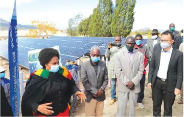  ?? — Picture: Tinai Nyadzayo ?? Informatio­n, Publicity and Broadcasti­ng Services Minister Monica Mutsvangwa (left) stresses a point while Gom - bakomba Secondary School headmaster Mr Peter Chirara (third from left), Headman Matthew Gombakomba (second from left) and Satewave Technologi­es chief executive officer Mr Zhou Zhongguo look on during the inspection of solar projects at Gombakomba Secondary School and electrific­ation of Gombakomba Village in Mutare South Constituen­cy yesterday.