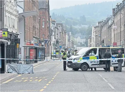  ?? Picture: Stuart Cowper. ?? Officers enforced a lockdown on part of South Street, between King Edward Street and Scott Street, as they carried out investigat­ions.