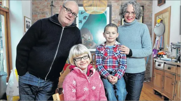  ?? Picture: Nick Ponty ?? FRESH START: Mark and Anne Coles, with adopted children Lily and Jack, welcomed attempts to increase the number of youngsters finding homes.