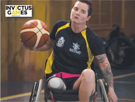  ??  ?? Australian Army soldier Corporal Sonya Newman practises her wheelchair basketball techniques ahead of the 2017 Invictus Games