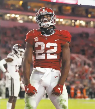  ?? UA Athletics / Collegiate Images / Getty Images ?? Alabama’s Najee Harris celebrates one of his nationlead­ing 14 touchdowns, this one against Mississipp­i State.