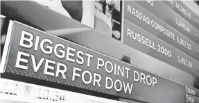  ?? RICHARD DREW/AP ?? The Dow plunged more than 1,100 points Monday, its biggest ever, but rebounded with a gain of more than 550 points Tuesday.