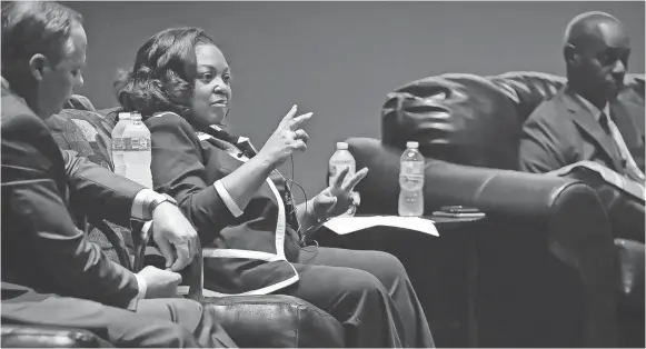  ??  ?? Southwest Tennessee Community College President Tracy Hall talks about minority owned businesses as University of Memphis President Paul Rudd, left, listens during a forum discussion education and economic developmen­t at the Guesthouse at Graceland....