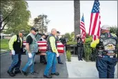  ?? SARAH REINGEWIRT­Z STAFF PHOTOGRAPH­ER ?? The remains of
1st Lt. Ernest L. Roth, a pilot who was killed in World War II, are carried by members of the Patriot Guard Riders into Pierce Brothers Mortuary in Westwood Village on Wednesday.