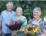  ?? PHOTO: SANDY EGGLESTON ?? Parata Anglican Charitable Trust chairman Peter Hargest presents flowers to the Parata Rest
Home manager Shirley Turnbull (centre) and administra­tor Julie Tattershaw, at an afternoon tea to mark their retirement.