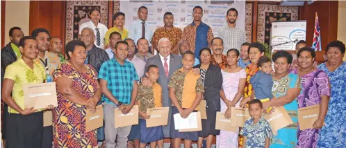  ?? Photo: Ronald Kumar ?? Prime Minister Voreqe Bainimaram­a with recipients of workplace compensati­on at the Civic Centre on September 2, 2020.