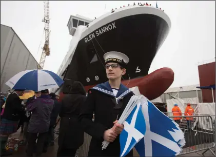  ??  ?? The MV Glen Sannox is launched, above and below, while Nicola Sturgeon is joined by Jim McColl, bottom right, at the event