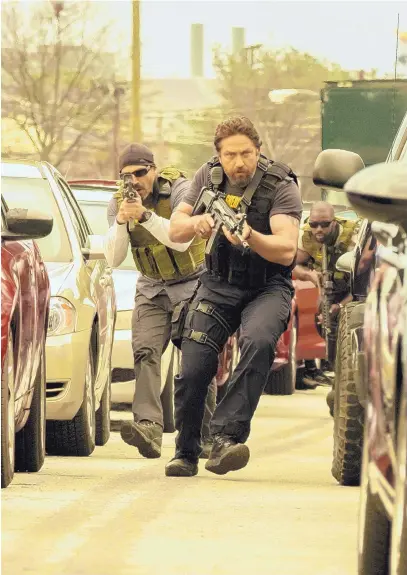  ?? COURTESY OF DANIEL MCFADDEN/STX FINANCING, LLC ?? Maurice Compte, left, and Gerard Butler star in “Den Of Thieves.”