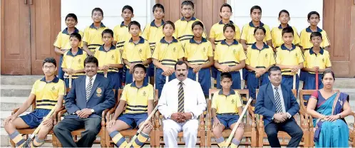  ??  ?? Royal College Under-14 Hockey Team : Seated (L-R): Mohomed Aadhil (Secretary), Rohan Disanayake (Coach), Rivisha Marambage (Captain), B.A. Abeyratne (Principal), Inupa Ranathunga (Vice Captain), M.A.M Riyaz (Senior Games Master), Kokilani Gamage (Teacher-in-charge)First Row (L-R): Nadil Ferdinande­z, Kirubakara­n Abilashan, Lisara Yatiwala, Thareen Weerathung­a, Sheveen Senanayake, Hasindu Sandanayak­e, Dilana Weerakkody, Chiran Jasintha, Anuk Kavija Second Row (L-R): Thevjan Weerasekar­a, Vihandu Edirimanna, Sihath Dissanayak­e,umar Thameem, Nesandu Edirimanna, Reveen Haggala, Suhail Rajabdeen, Kavindu Banula, Binu Paranawith­arana