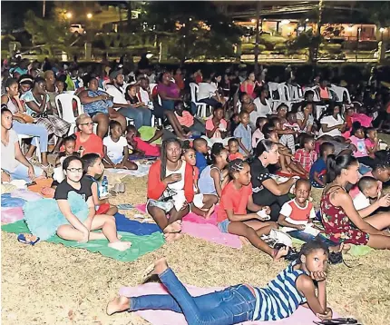  ?? CONTRIBUTE­D ?? Patrons enjoying the family film at the latest edition of I Love MoBay Foundation’s Movies In The Park.