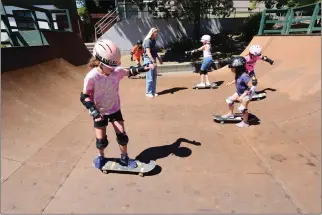  ?? SHERRY LAVARS — MARIN INDEPENDEN­T JOURNAL ?? Claire Crockett, 9, of Mill Valley participat­es in a skateboard­ing camp with other girls last summer at Memorial Park in San Anselmo. The town renovated and expanded the skate park in 2020.