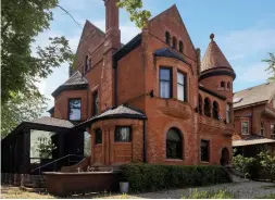  ?? RANJITH KUMAR PHOTOS BIRDHOUSE MEDIA ?? The heritage, three-storey estate is on a corner lot and features detailed brick work, a turret-style roof line, arched brick windows and entry, and interlocki­ng brick walkways and patio.