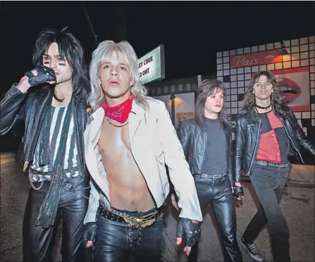  ?? Jake Giles Netter Netf lix ?? NETFLIX’S Motley Crue biopic, “The Dirt,” shows unsparingl­y how, from left, Nikki Sixx (Douglas Booth), Vince Neil (Daniel Webber), Mick Mars (Iwan Rheon) and Tommy Lee (Colson Baker, a.k.a. rapper Machine Gun Kelly) experience­d life in 1980s L.A.