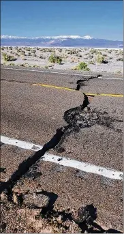  ?? NEVADA HIGHWAY PATROL VIA AP ?? Earthquake damage is seen on U.S. Highway 95 early Friday in a remote area west of Tonopah, Nevada. The highway was closed for repairs for 10 hours after the magnitude-6.5 earthquake struck.