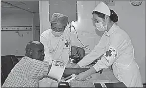  ??  ?? Medical workers check blood pressure of a man in the Chinese hospital ship Peace Ark in Djibouti. (Photo: Xinhua)