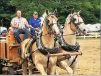 ?? PAUL POST — PPOST@DIGITALFIR­STMEDIA.COM ?? A team of large Belgian draft horses take part in Saratoga County Fair’s opening ceremonies on Tuesday. Late Galway Supervisor Paul Lent was superinten­dent of the fair’s draft horse department.