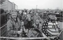  ?? [JACQUELINE LARMA/ THE ASSOCIATED PRESS] ?? Kyle Terry, 33, front left, stands at the head of the line of supporters waiting to attend a campaign rally for President Donald Trump on Monday at Lancaster Airport in Lititz, Pa.