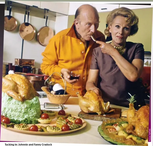  ??  ?? Tucking in: Johnnie and Fanny Cradock