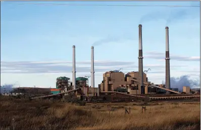  ?? The New York Times/JANIE OSBORNE ?? A coal-burning power plant operates in October in Colstrip, Mont. Under a proposal made public Friday by the Environmen­tal Protection Agency, restrictio­ns and penalties on mercury emissions by coal-burning plants would be removed. The EPA said current rules are too costly to justify.