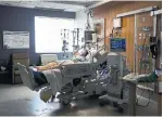  ??  ?? Health-care staff ready a 47-year-old woman who has COVID-19 at Humber River Hospital Tuesday. The woman is intubated on a ventilator. There are about 50 patients in the ICU.