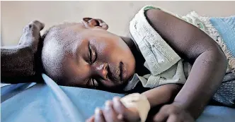  ?? | Reuters ?? A YOUNG girl with malaria rests in the inpatient ward of a health centre in South Sudan. Many African countries lack basic infrastruc­ture, such as hospitals, electricit­y, roads or equipment, but inexpensiv­e modern technology, such as drones, could prove to be the answer in tackling diseases like malaria.