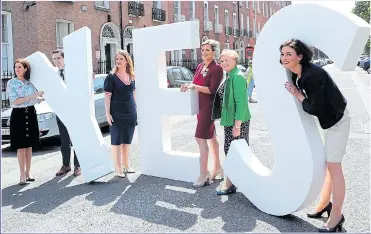  ?? Picture: PA ?? TEST: Fine Gael politician­s in Dublin get their referendum message across
