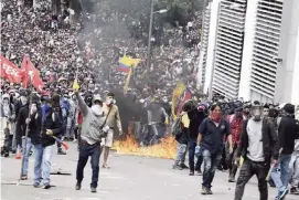  ?? FERNANDO VERGARA AP ?? Anti-government demonstrat­ors protest against President Lenin Moreno and his economic policies in Quito, Ecuador, on Tuesday.
