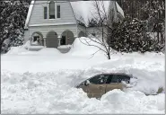  ?? PHOTOS BY NEW YORK STATE POLICE VIA AP ?? A car, in Owego, N.Y., from which a New York State Police sergeant rescued Kevin Kresen, 58, of Candor, N.Y., stranded for 10 hours, covered by nearly 4 feet of snow thrown by a plow during this week’s storm.