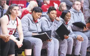  ?? Ben Solomon / Rutgers Athletics ?? Rutgers assistant women’s basketball coach Nadine Domond, third from left, was a former star at Bridgeport Central.
