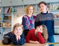  ?? ?? Top: Cathy on set. Above: with husband John, and daughters Scarlett and Molly, 2016