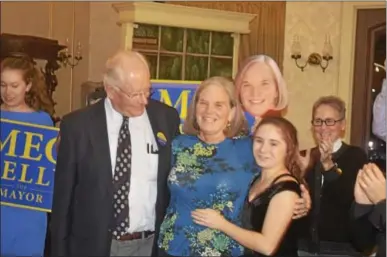  ?? JOSEPH PHELAN -- JPHELAN@DIGITALFIR­STMEDIA.COM ?? Democrat Meg Kelly gathers with her family Tuesday night soon after hearing she’ll be the next mayor of Saratoga Springs.