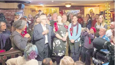  ?? AP ?? Labour leader Jeremy Corbyn speaks to people during a visit to the Royal Scot Pub in Carlisle, England, while on the general election campaign trail yesterday. Many Jamaicans in the United Kingdom believe the Labour Party represents the best option for minorities at this time.