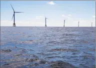  ?? Eric Thayer / Bloomberg ?? The GE-Alstom Block Island Wind Farm stands in the water off Block Island, R.I.