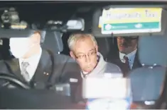  ??  ?? Greg Kelly, the former deputy of ousted Nissan chairman Carlos Ghosn, is seen in the car, as he leaves after being released from a detention centre in Tokyo, Japan, December 25. — Reuters photo