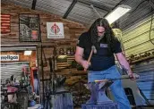  ?? ?? Army retiree Joseph Burks stretches steel at the workshop in San Antonio. He has made seven knives.