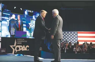  ?? Emil LIPPE For THE Washington Post ?? Former president Donald Trump greets Matt Schlapp at a 2021 CPAC in Dallas. Trump is set to attend this week’s CPAC in Washington, but emerging 2024 rival Gov. Ron Desantis of Florida is skipping it.