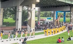  ??  ?? A parade makes its way through the Bentway block party.