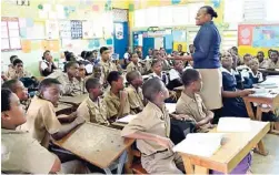  ??  ?? Vice- principal Sheryl Mitchell attends to her class of 64 students at Anchovy Primary School.