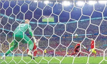  ?? AGENCIES ?? Brazil’s Richarliso­n scores a stunning bicycle kick against Serbia in their World Cup opener.