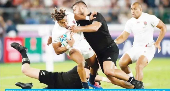  ??  ?? YOKOHAMA: England’s wing Anthony Watson (front L) is tackled during the Japan 2019 Rugby World Cup semi-final match between England and New Zealand at the Internatio­nal Stadium Yokohama in Yokohama yesterday. — AFP