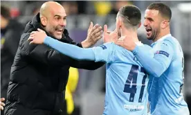  ?? PA Wire/DPA/PA ?? Manchester City manager Pep Guardiola with Kyle Walker (right) and Phil Foden. Photograph: