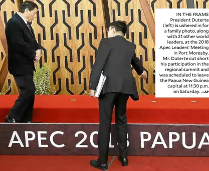  ?? —AP ?? IN THE FRAME President Duterte (left) is ushered in for a family photo, along with 21 other world leaders, at the 2018 Apec Leaders’ Meeting in Port Moresby. Mr. Duterte cut short his participat­ion in the regional summit and was scheduled to leave the Papua New Guinea capital at 11:30 p.m. on Saturday.