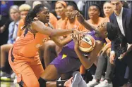  ?? Jessica Hill / Associated Press ?? Connecticu­t Sun’s Shekinna Stricklen, left, pressures Los Angeles Sparks’ Chiney Ogwumike, right, during the second half of Game 1 of a WNBA playoff series on Sept. 17 in Uncasville.