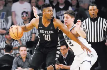  ?? Frank Franklin II ?? Butlerforw­ard Kelan Martin tries to get past Villanova guard Collin Gillespie in the Big East tournament semifinals on Friday. No. 10 Butler is the only lower seed to be favored in NCAA Tournament round-of-64 play — by one point over No. 7...